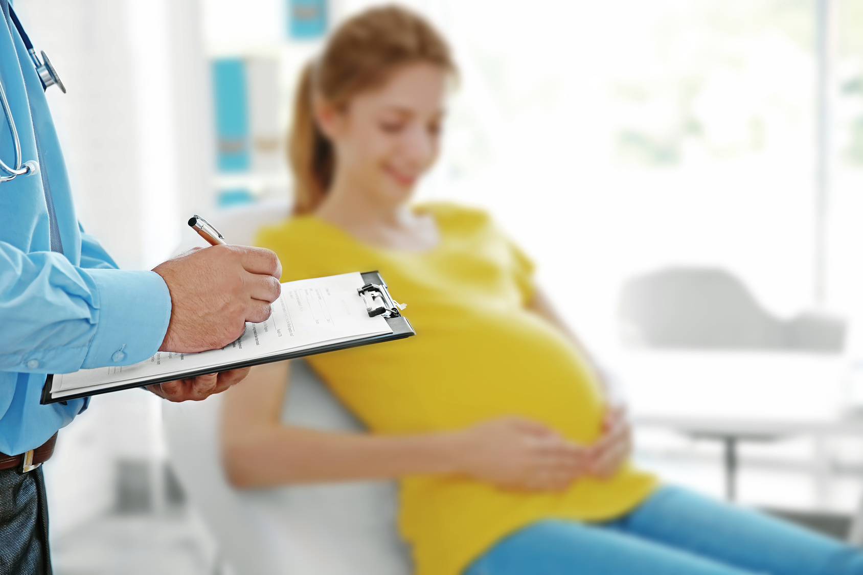 Pregnant young woman at doctor’s office